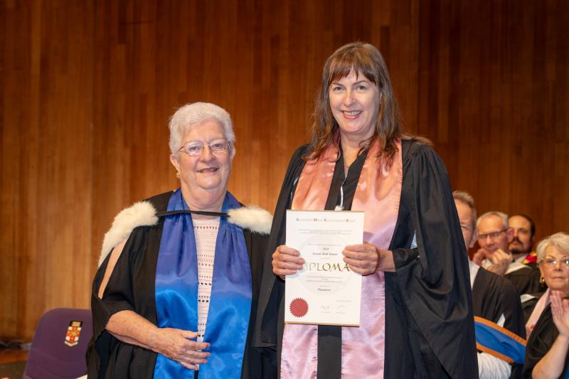 Leonie Hunter receiving her LMusA from federal examiner Lyn Morgan